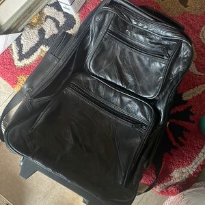 Black leather rolling bag